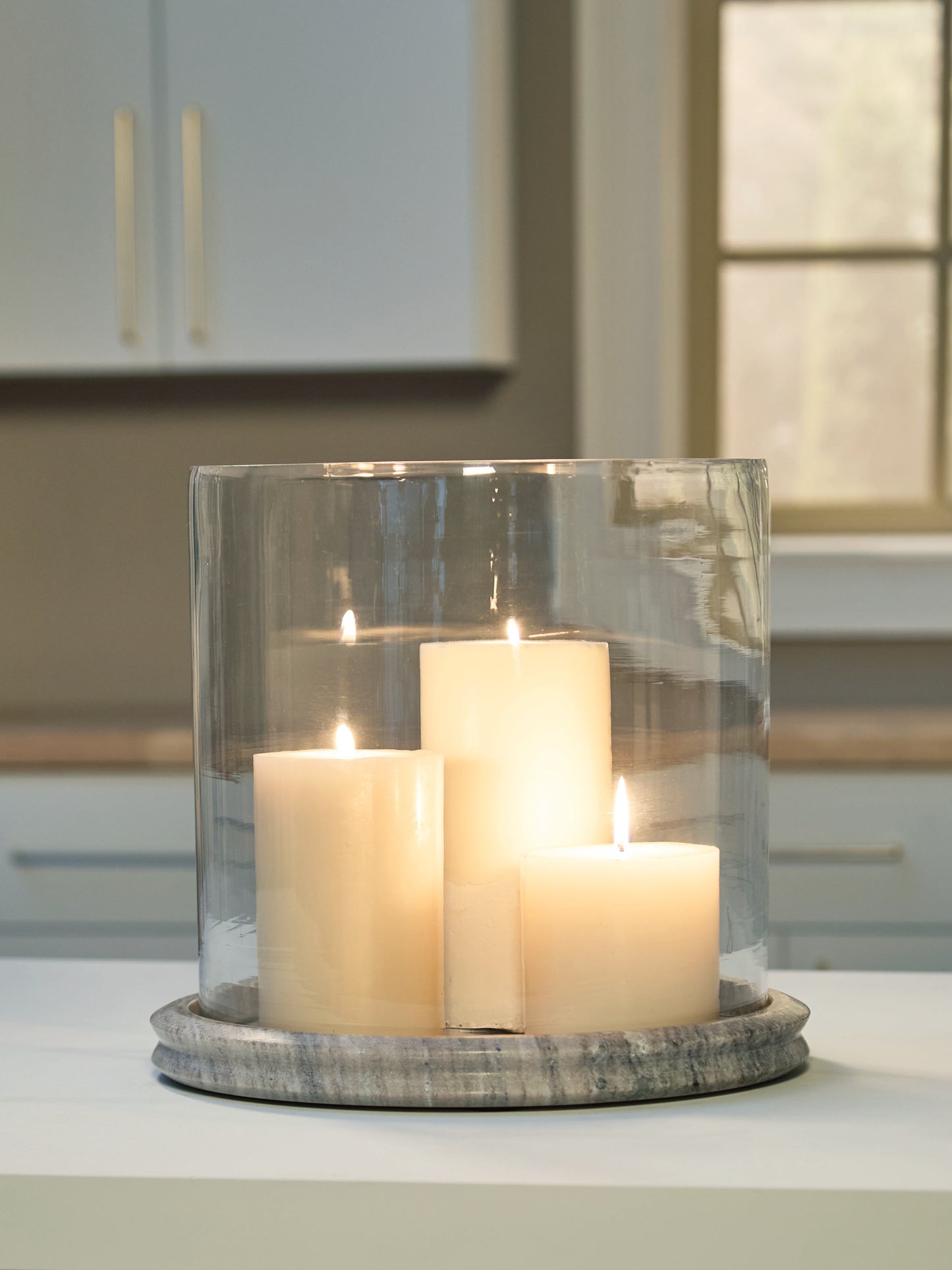Ocala Furniture Outlet - Ashley Furniture - Saskia Candle Holder - Candle Holder / Clear/Beige - A2000847