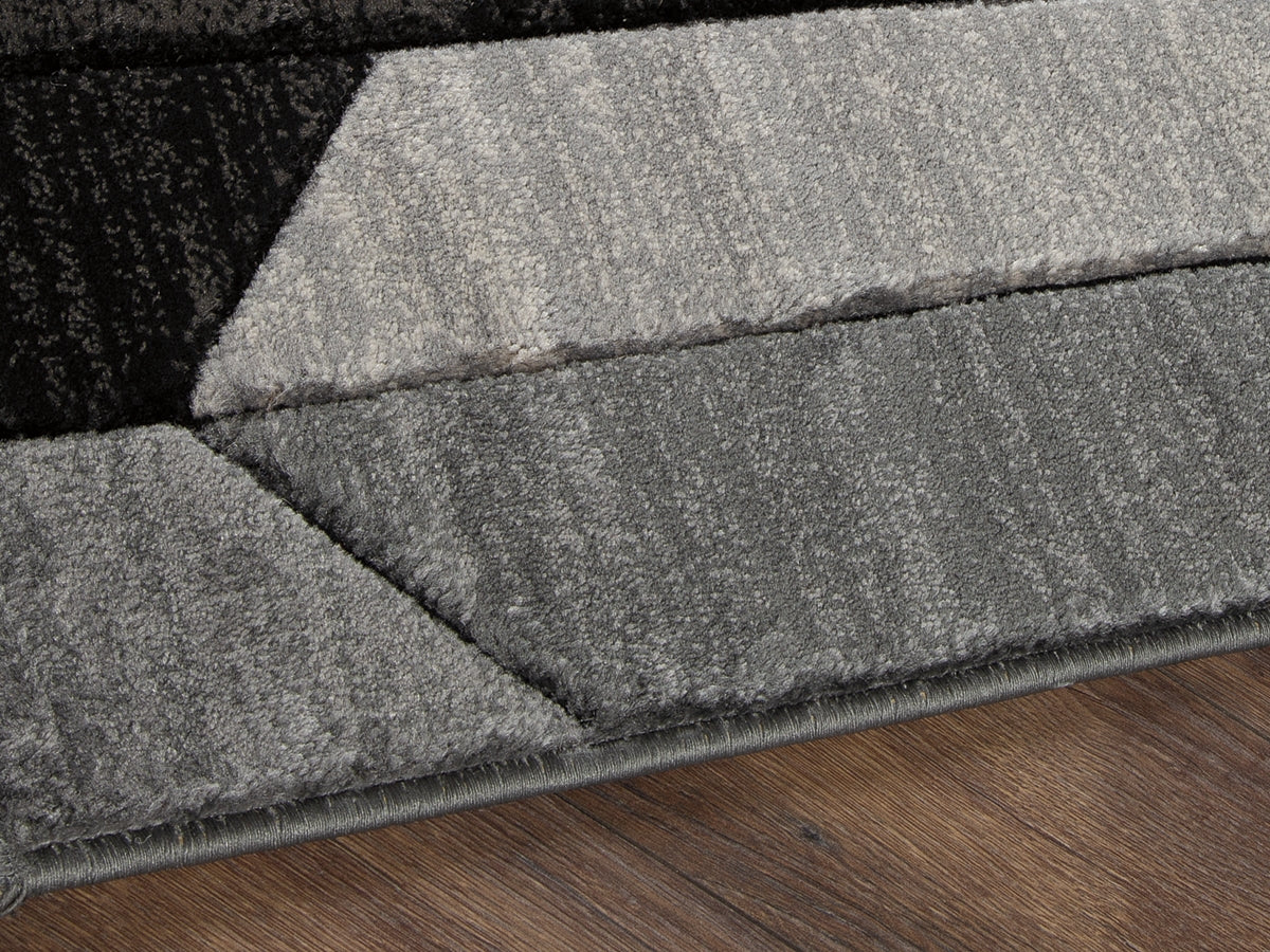 Ocala Furniture Outlet - Ashley Furniture - Chayse Rug - 5' x 6'7" Rug / Black/Gray - R403462