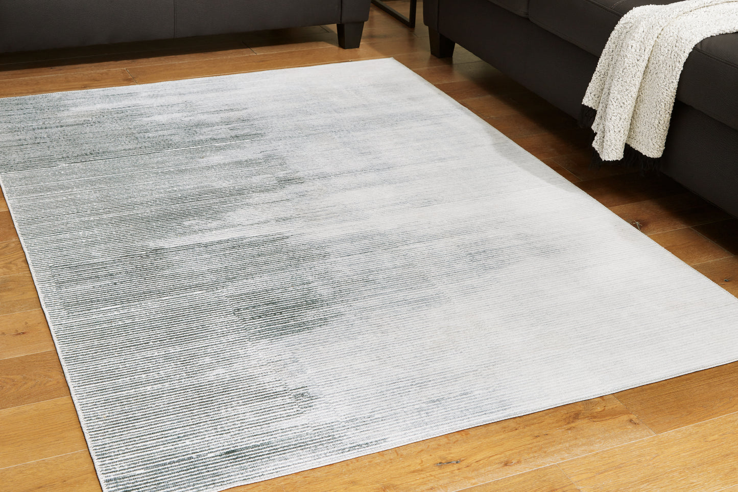 Ocala Furniture Outlet - Ashley Furniture - Milset Rug - 5'1" x 6'10" Washable Rug / Black/White/Gray - R406252