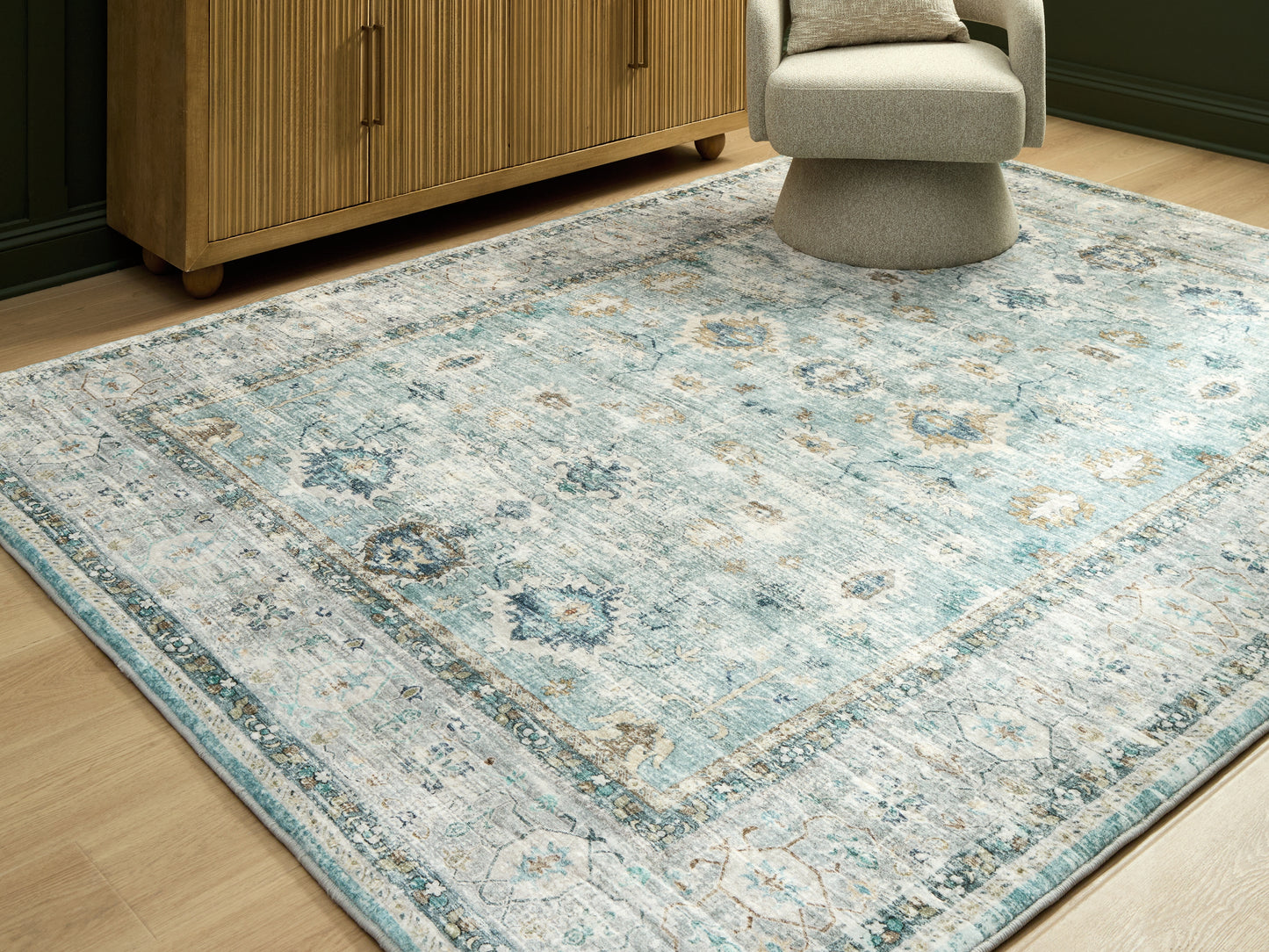 Ocala Furniture Outlet - Ashley Furniture - Ladstoney Rug - 7'6" x 9'6" Area Rug / Teal/Beige/Ochre - R407501