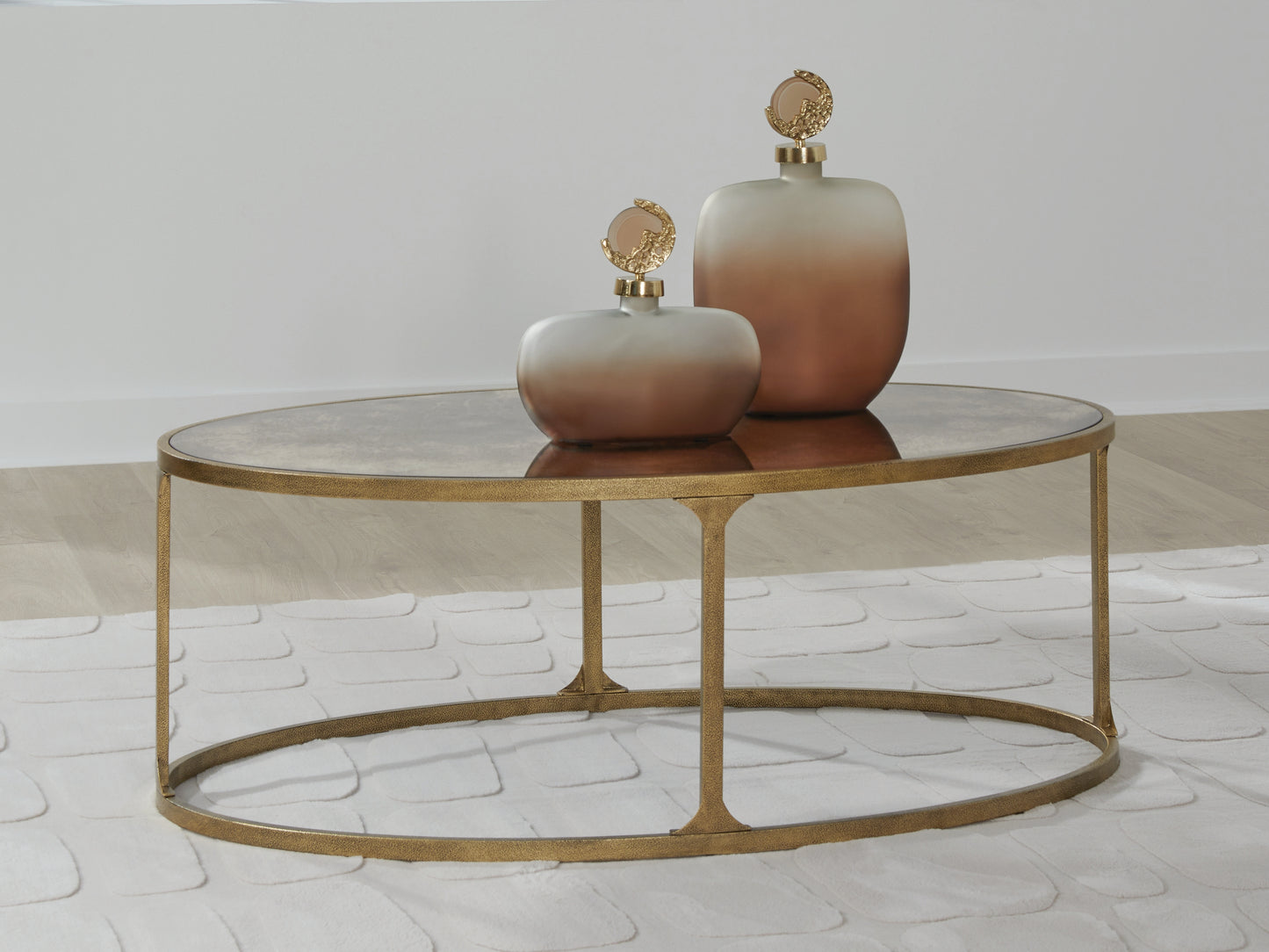 Ocala Furniture Outlet - Ashley Furniture - Korajane Coffee Table - Oval Cocktail Table / Antique Gold - T399-0