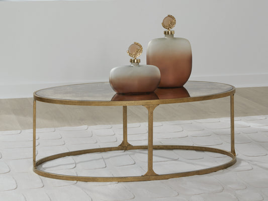 Ocala Furniture Outlet - Ashley Furniture - Korajane Coffee Table - Oval Cocktail Table / Antique Gold - T399-0