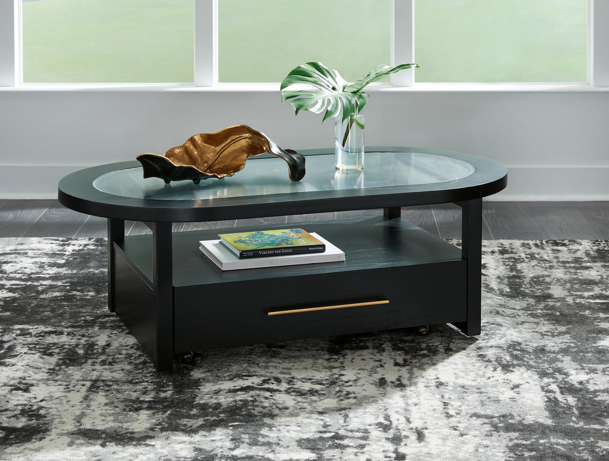 Ocala Furniture Outlet - Ashley Furniture - Winbardi Coffee Table - Oval Cocktail Table / Black - T786-0