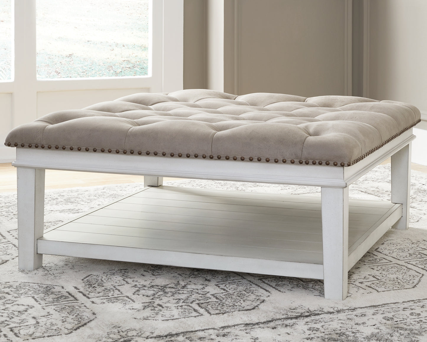 Ocala Furniture Outlet - Ashley Furniture - Kanwyn Upholstered Ottoman Coffee Table - UPH Ottoman Cocktail Table / Whitewash - T937-21