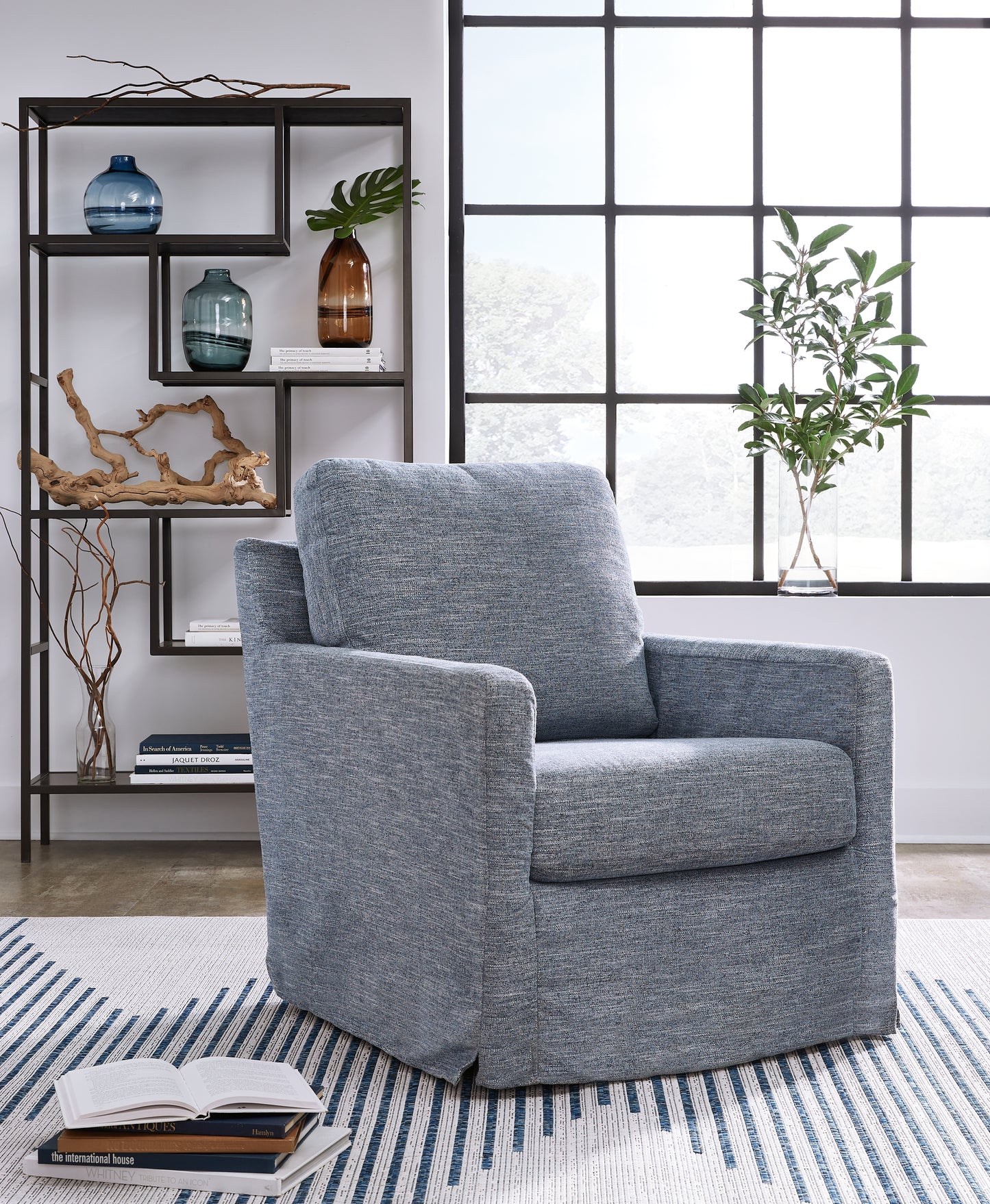 Ocala Furniture Outlet - Ashley Furniture - Nenana Next-Gen Nuvella Swivel Glider Accent Chair - Swivel Glider Accent Chair / Denim - A3000646