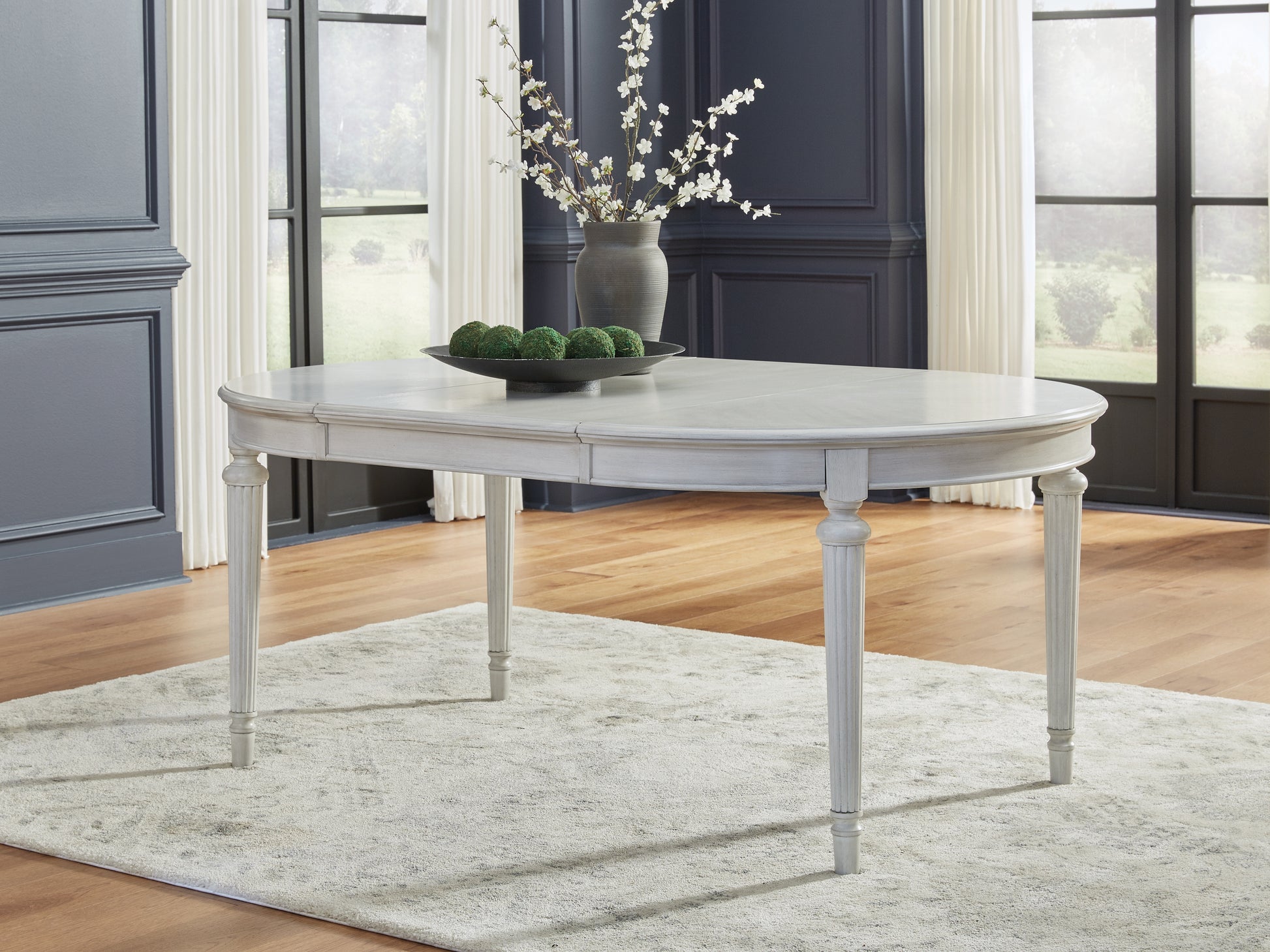 Ocala Furniture Outlet - Ashley Furniture - Montelaine Dining Room - Oval Dining Room EXT Table / Antique White - D795-35