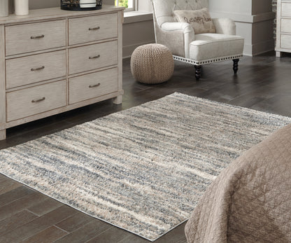 Ocala Furniture Outlet - Ashley Furniture - Gizela Rug - 7'10" x 10' Rug / Ivory/Beige/Gray - R404861