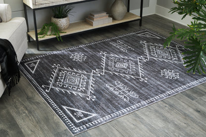 Ocala Furniture Outlet - Ashley Furniture - Arloman Rug - 5' x 7' Washable Rug / Black/Cream/Gray - R405932