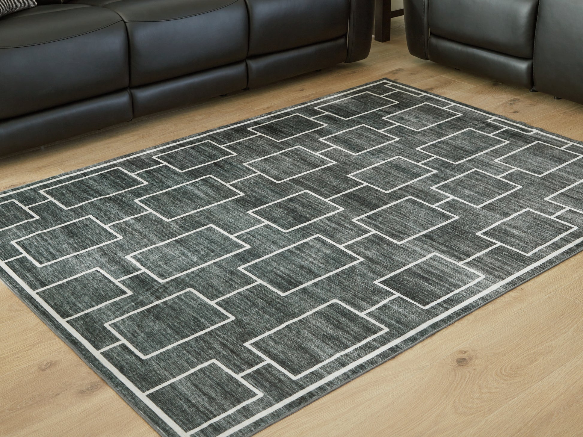 Ocala Furniture Outlet - Ashley Furniture - Elderland Rug - Washable 7'6" x 9'6" Area Rug / Black/Gray - R407401