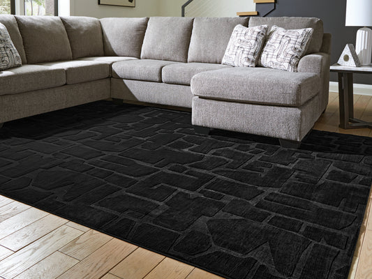 Ocala Furniture Outlet - Ashley Furniture - Gibbswell Rug - Washable 5' x 7' Area Rug / Black - R407462