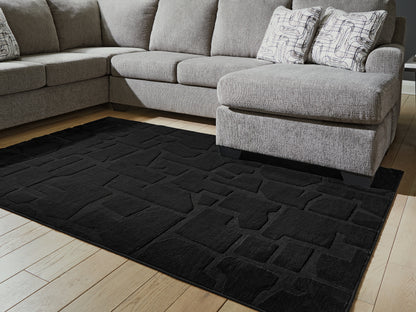Ocala Furniture Outlet - Ashley Furniture - Gibbswell Rug - Washable 5' x 7' Area Rug / Black - R407462