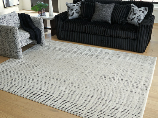 Ocala Furniture Outlet - Ashley Furniture - Turinwith Rug - 5'3" x 7' Area Rug / Ivory/Black - R407552