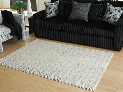 Ocala Furniture Outlet - Ashley Furniture - Turinwith Rug - 5'3" x 7' Area Rug / Ivory/Black - R407552