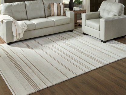Ocala Furniture Outlet - Ashley Furniture - Gadence Rug - 7'8" x 10' Area Rug / Ivory/Tan - R407641