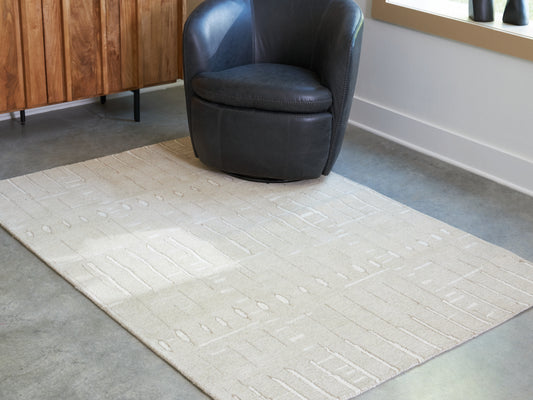 Ocala Furniture Outlet - Ashley Furniture - Wolbert Rug - 7'8" x 10' Area Rug / Tan/Ivory - R407661