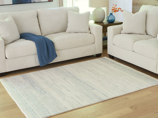 Ocala Furniture Outlet - Ashley Furniture - Genemost Rug - 5' x 7' Area Rug / Ivory/Blue - R407842